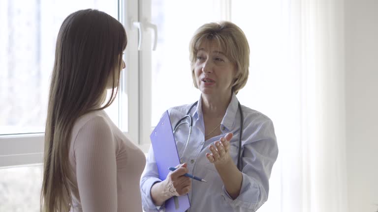Femal Pacient Female Nurse With Chart Videos and HD Footage - Getty Images
