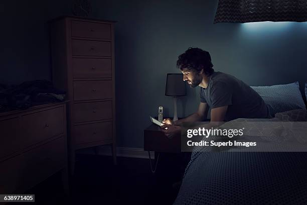 man checks tablet - een dag uit het leven serie stockfoto's en -beelden