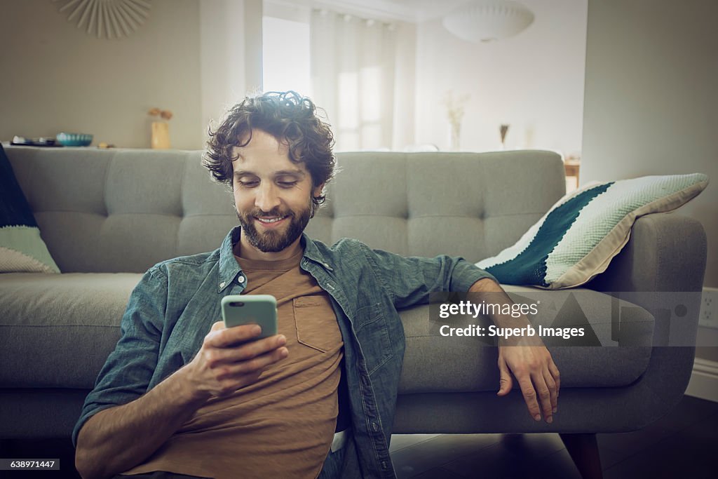 Man checks smartphone