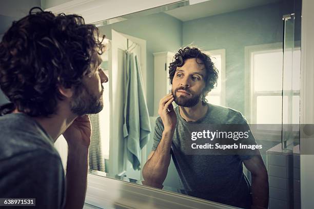 man grooming in bathroom - mirror imagens e fotografias de stock