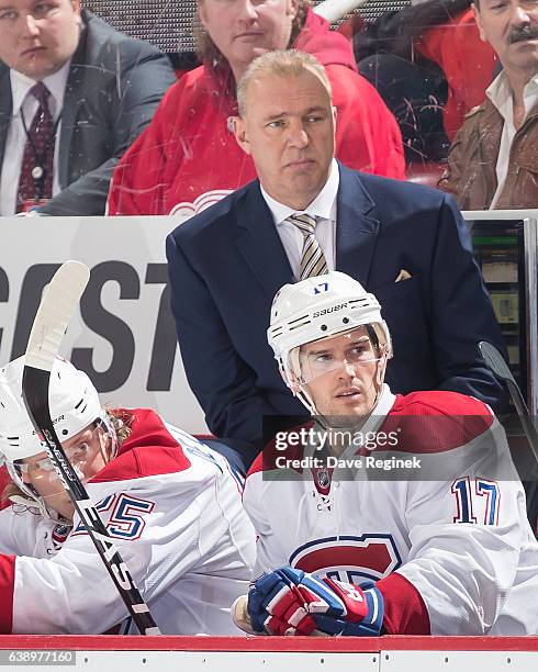 Head coach Michel Therrien of the Montreal Canadiens watches the action from the bench against the Detroit Red Wings during an NHL game at Joe Louis...