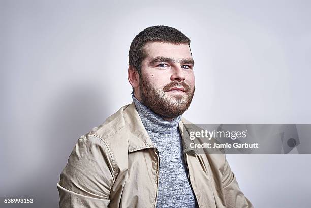 british bearded male looking surprised - mock turtleneck foto e immagini stock
