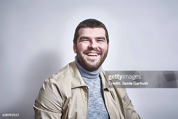 british bearded male laughing to camera - mock turtleneck fotografías e imágenes de stock