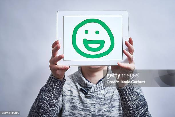 a male showing his feelings drawn on a tablet - newnaivetytrend ストックフォトと画像