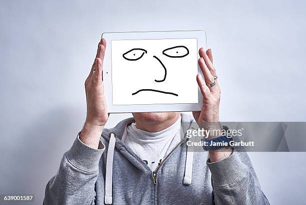 a male showing his feelings drawn on a tablet - newnaivetytrend stock-fotos und bilder