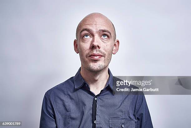 british bald male looking up - hair loss stock pictures, royalty-free photos & images