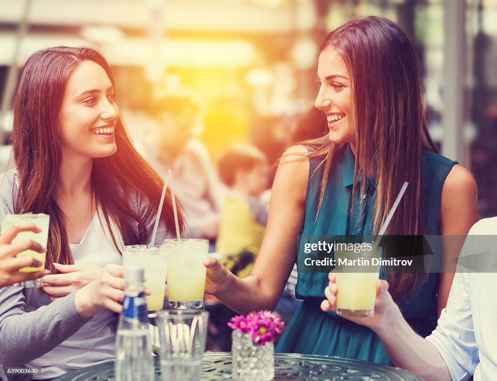 Friends drinking cocktails together