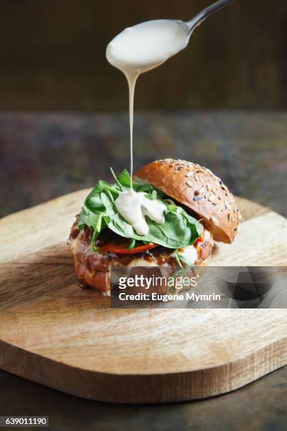 burger with beef - sauce stock pictures, royalty-free photos & images