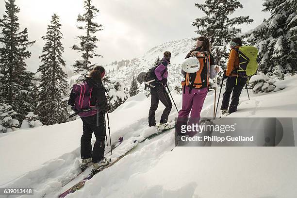 Skiers pause to enjoy the view on a ski touring trek up the Scheinberg mountain in the Ammergau alps on January 15, 2017 near Oberammergau, Germany....