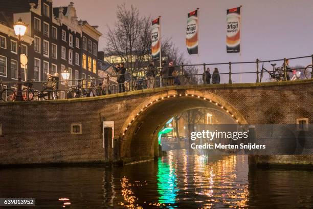 spectators during amsterdam light festival - amsterdam light festival stock pictures, royalty-free photos & images