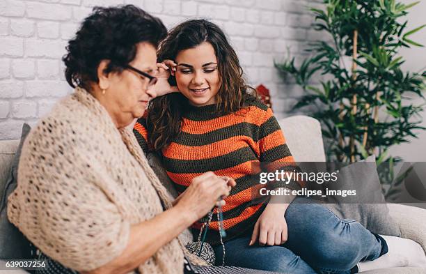 grandmother with granddaughter getting ready to knit - old granny knitting stock pictures, royalty-free photos & images