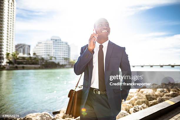 businessman on the phone in brickell miami - brickell miami stock pictures, royalty-free photos & images