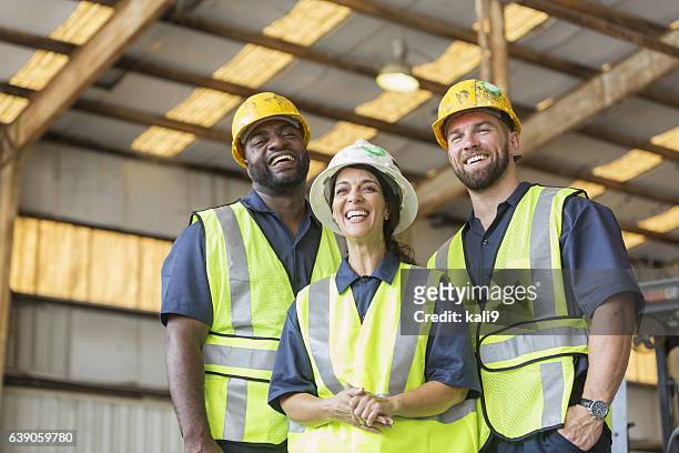 construction crew with female boss - high vis stock pictures, royalty-free photos & images
