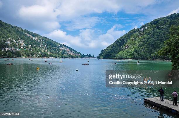 view of nainital lake surrounded by mountains and blue sky - lakeland florida stock pictures, royalty-free photos & images