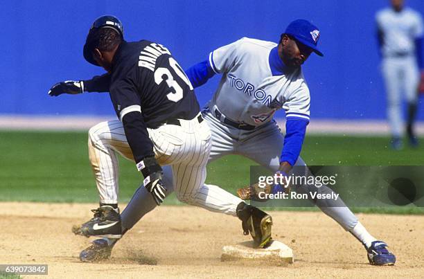 Tim Raines of the Chicago White Sox steals second base under the tag of Alfredo Griffin of the Toronto Blue Jays during the American League...