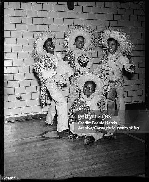 Letsche School students Hattie Nettles, Ellis Montague, Loretta Clancy, and Charles Thomas seated in front, in 'Mexican dancer' costumes for...