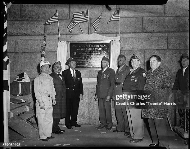 Eight men, including Spanish American War Veterans William L. Porter, Benjamin T. Frazier, and Ernest G. Brightful in center, posed next to VFW...