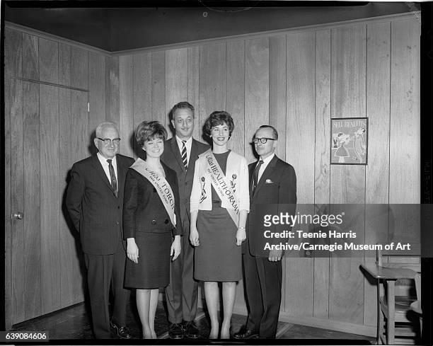 Group portrait of Health-O-Rama Steering Committee members Dr Earl A. Dimmick, 'Miss Torch' Linda Richards, unknown man wearing striped necktie,...