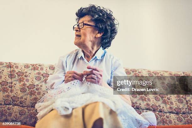 skillful senior woman making crochet - eastern european culture stock pictures, royalty-free photos & images
