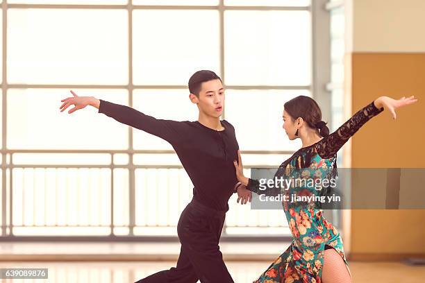 couple dancing tango - ballroom dance stock pictures, royalty-free photos & images