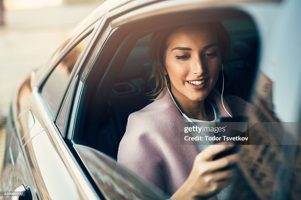 Woman listening to music in a car