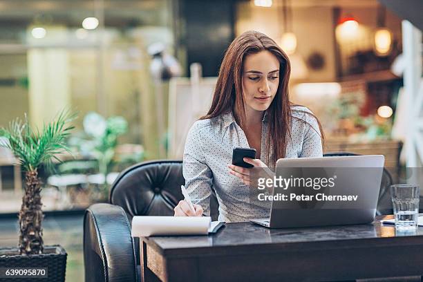 business and multi-tasking - woman signing stock pictures, royalty-free photos & images