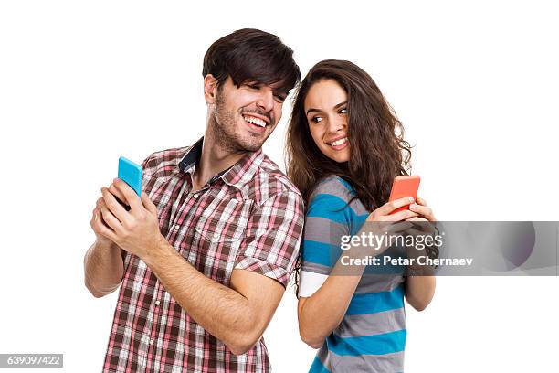 couple with cell phones - two people white background stock pictures, royalty-free photos & images