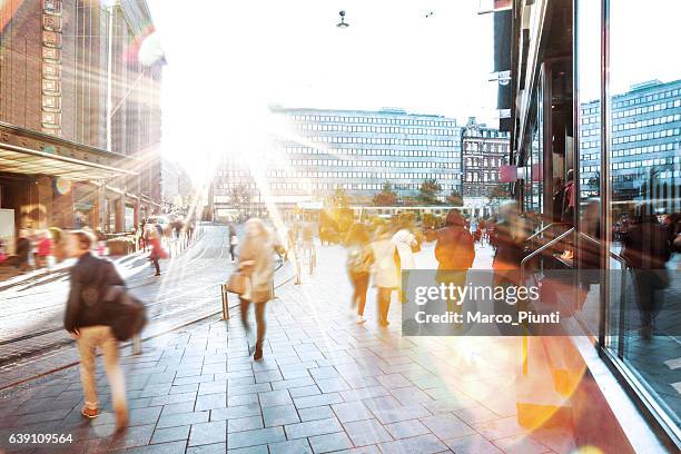 motion blur of people walking in the city - helsinki stock pictures, royalty-free photos & images