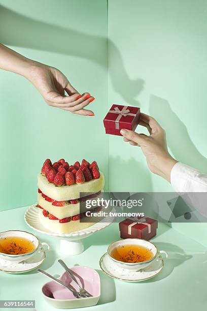 couple celebrating special event table top shot. - dinner party menschen raum elegant stock-fotos und bilder