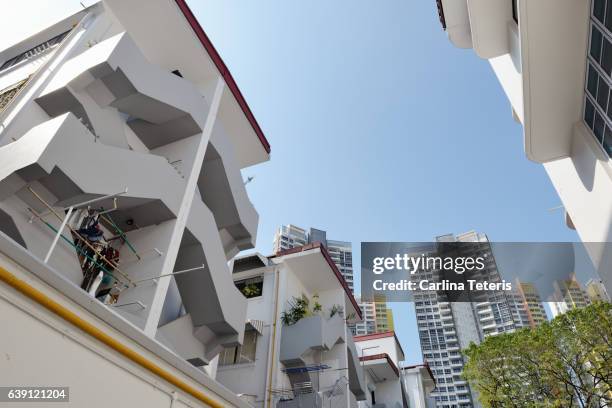 looking up at tiong bahru's conservation apartments - singapore alley stock pictures, royalty-free photos & images