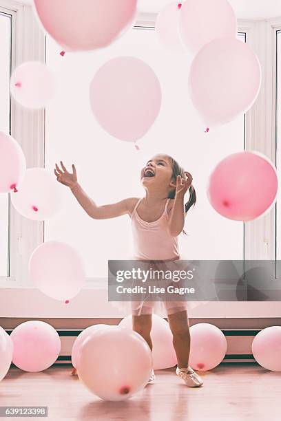 little girl in a pink world - embellished dress stock pictures, royalty-free photos & images
