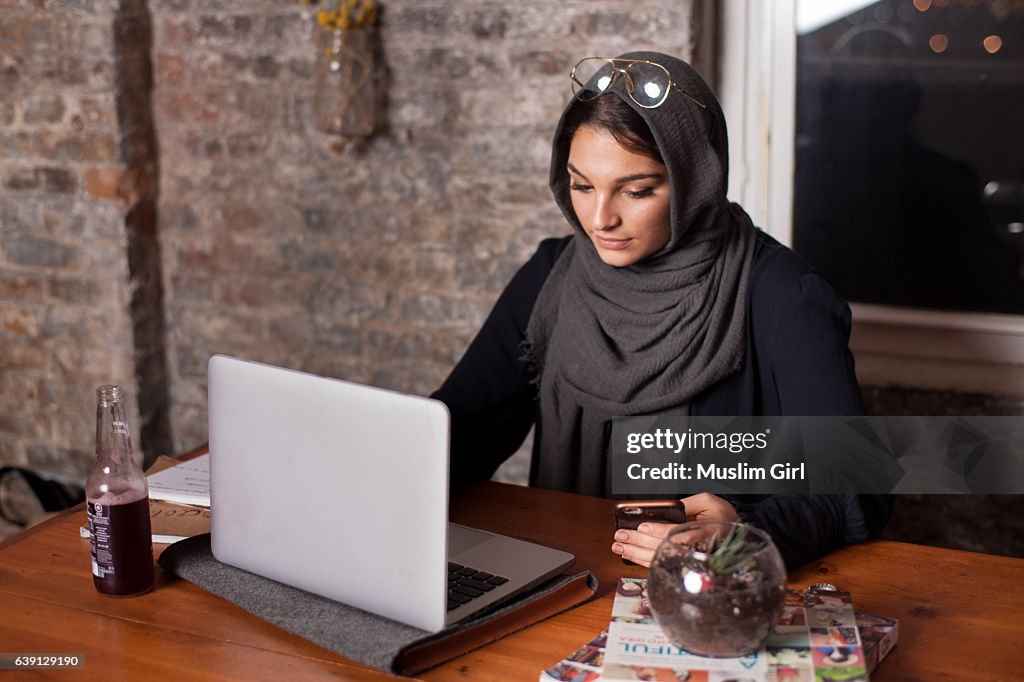 #MuslimGirl working on the computer