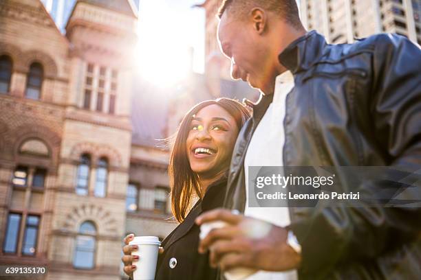 happy friends hanging out in the city - daily life in toronto stock pictures, royalty-free photos & images