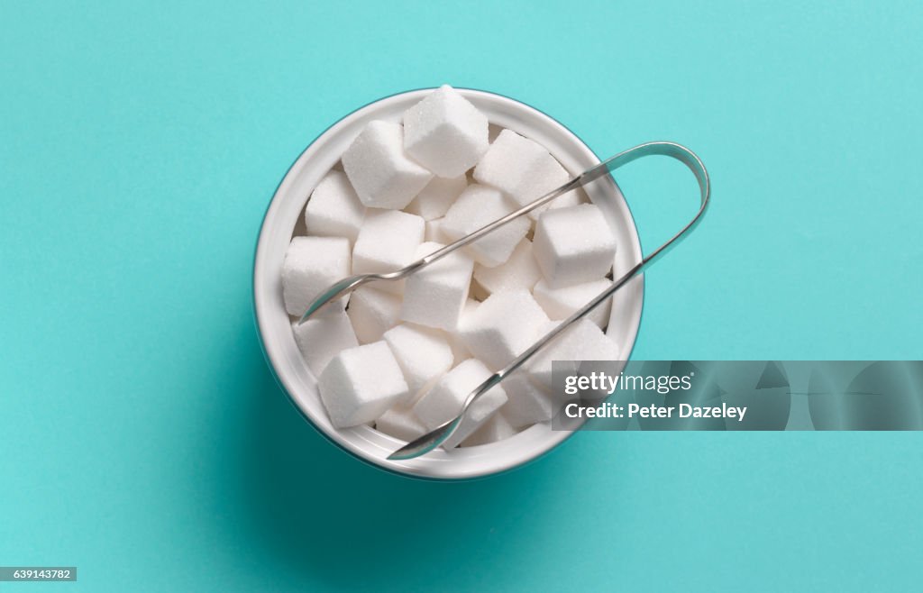 Sugar cubes in sugar bowl