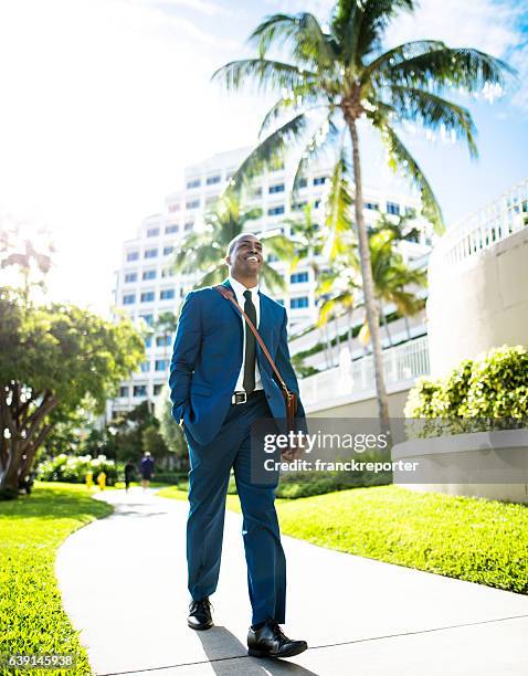 businessman walking in brickell miami - miami business imagens e fotografias de stock