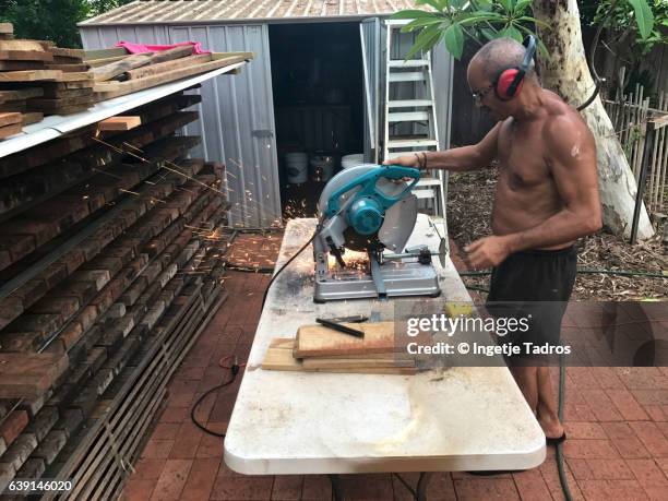 Man Using Drop Saw Man On Ladder Saw Photos and Premium High Res Pictures - Getty Images