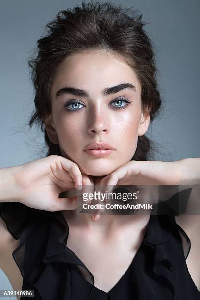 studio shot of young beautiful woman - high fashion hair stock pictures, royalty-free photos & images