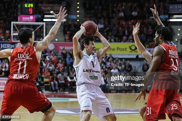 Vladimir Lucic Bayern Muenchen, Devin Booker of Bayern Muenchen and Ben Madgen of Lietkabelis Panevezys battle for the ball during the Eurocup Top 16...