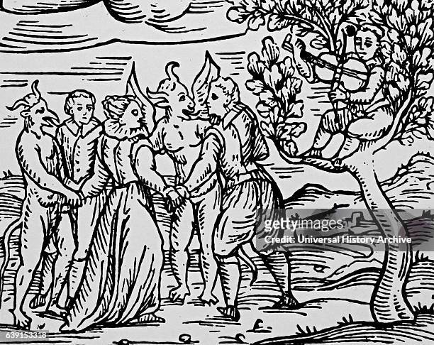 Woodcut depicting a group of witches and warlocks dancing with the Devil at the Sabbath. From Francesco Maria Guazzo Compendium Maleficarum. Dated...