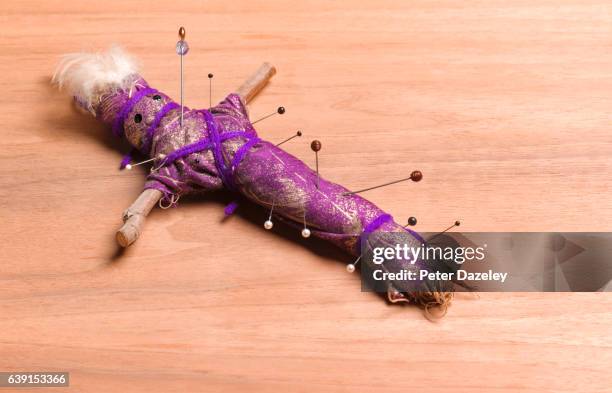 voodoo doll with pins - voodoo doll stock pictures, royalty-free photos & images