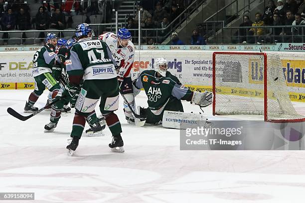 Christoph Ullmann of Adler Mannheim and Goalie Jonathan Boutin of Augsburger Panther battle for the ball during the DEL match between Augsburg...