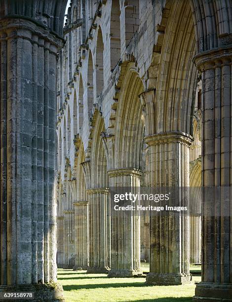 Rievaulx Abbey, North Yorkshire, c1990-2010. The arches on the south side of the presbytery from the east end of the abbey church - autumn sunshine....
