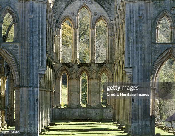 Rievaulx Abbey, North Yorkshire, c1990-2010. The window at the east end of the abbey church showing autumn colour on the trees beyond. A former...