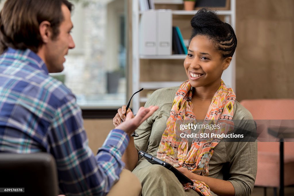 Caucasian counseling patient talks with counselor
