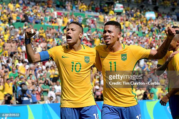 Day 12 Neymar of Brazil celebrates a goal by team mate Gabriel Jesus of Brazil during the Brazil Vs Honduras Men's Semifinal match at Maracana...