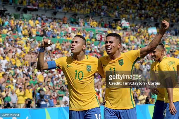 Day 12 Neymar of Brazil celebrates a goal by team mate Gabriel Jesus of Brazil during the Brazil Vs Honduras Men's Semifinal match at Maracana...