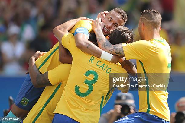 Day 12 Neymar of Brazil celebrates with team mates Marquinhos of Brazil, Rodrigo Caio of Brazil, Luan of Brazil after a goal during the Brazil Vs...