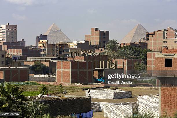 The Pyramid of Khafre and the Great Pyramid of Giza viewed from the city.