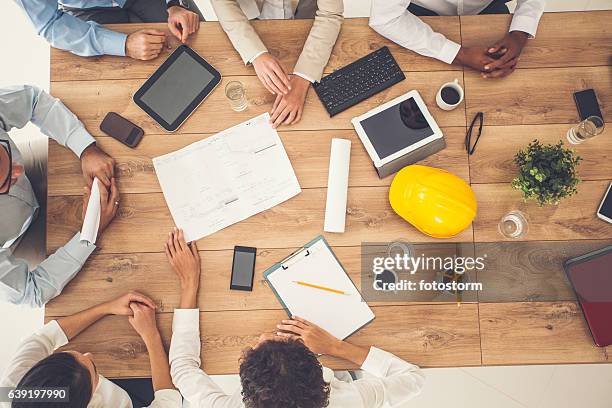 top view of business people on a meeting - design studio stock pictures, royalty-free photos & images