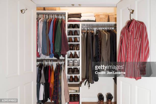 closet in home with mens clothes arranged neat - placard fotografías e imágenes de stock